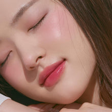 Load image into Gallery viewer, Close-up of model with Rom&nd Lychee Chip blush – soft, natural finish